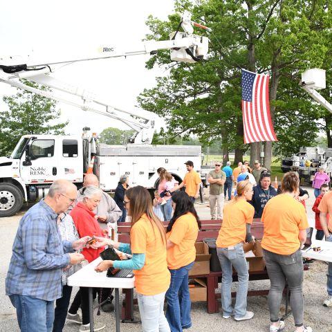 Registration tables with members lined up
