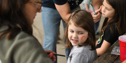 Little girl getting face painted
